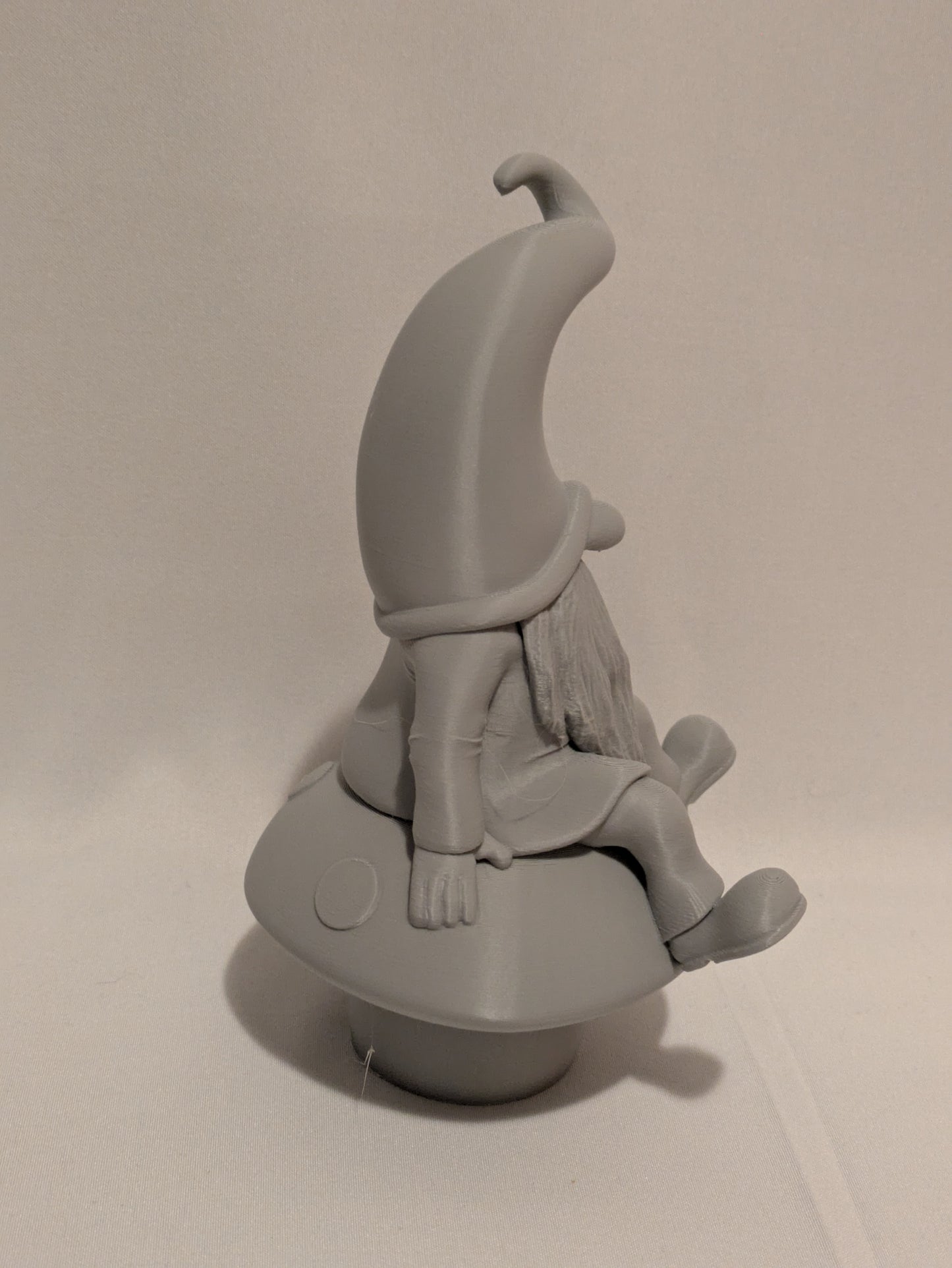 Gnome sitting on a mushroom