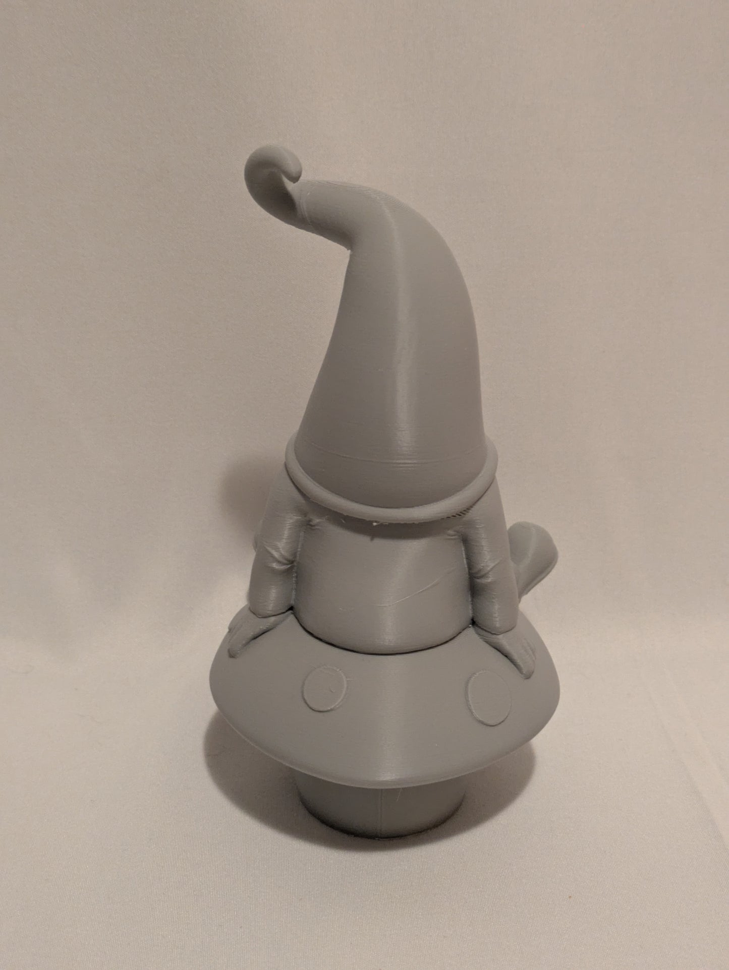 Gnome sitting on a mushroom